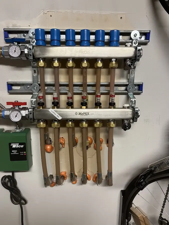 Plumber performing Water Heater Repair at a residential property in Taylorsville